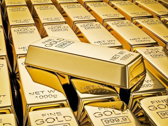 Gold bullion bars stacked in rows